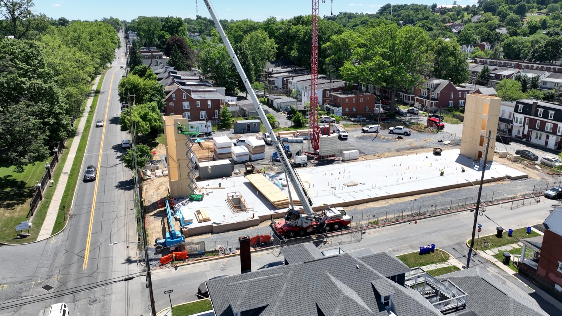 Mass timber delivery and crane activity at Woodward Lofts